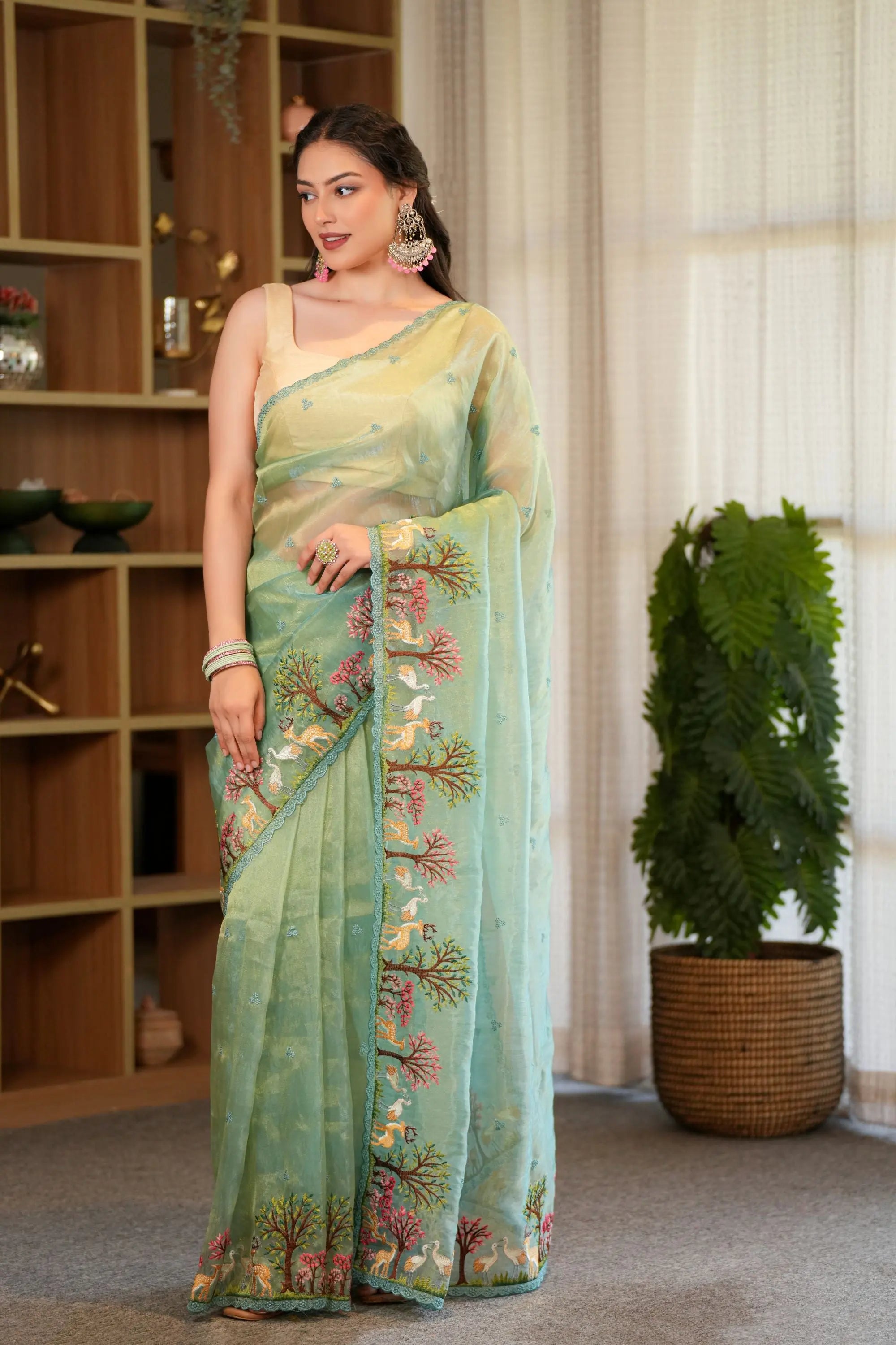 Image of Anika : Teal shade of Embroidered tissue saree with unstitched blouse Sathiraa Sarees