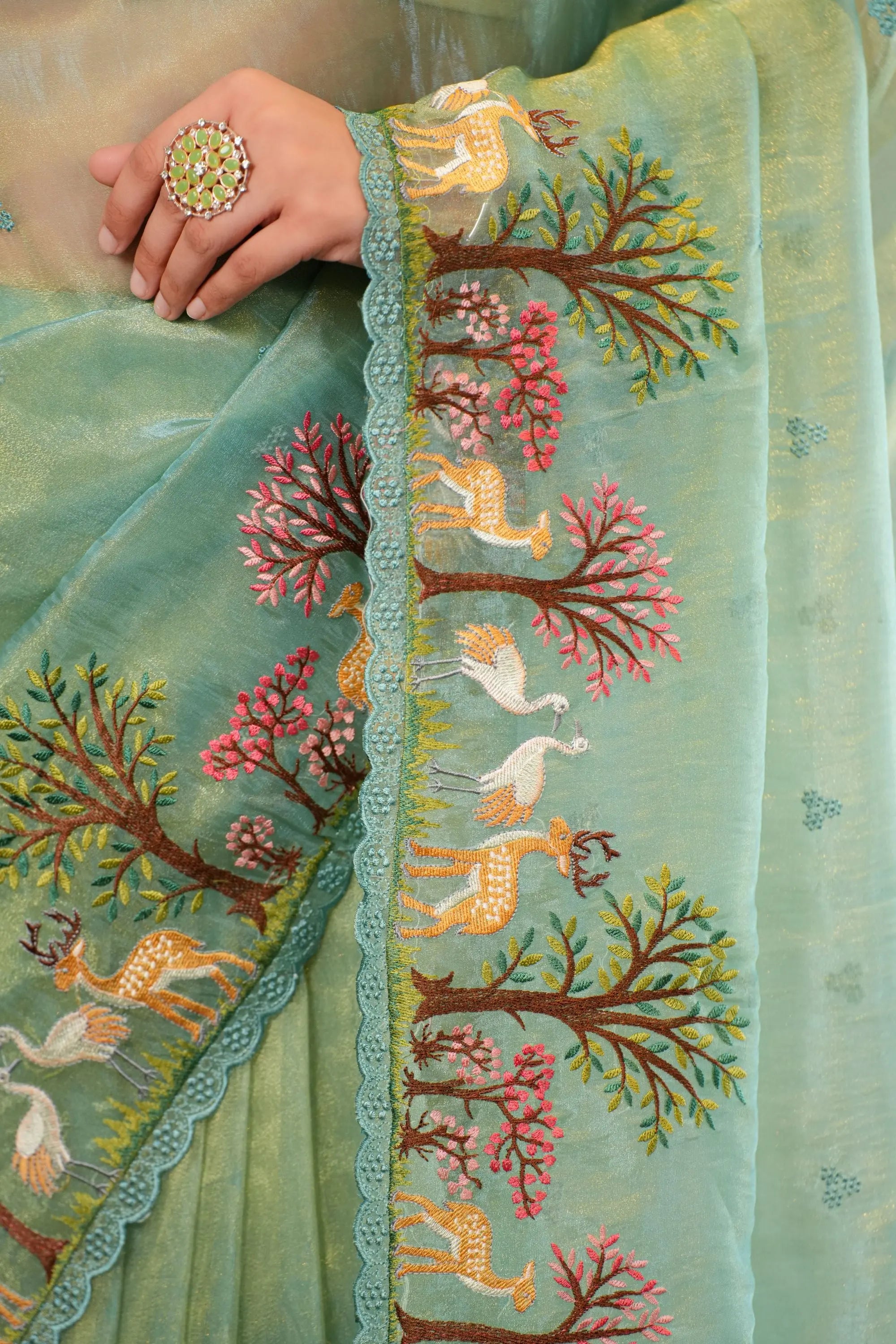 Image of Anika : Teal shade of Embroidered tissue saree with unstitched blouse Sathiraa Sarees